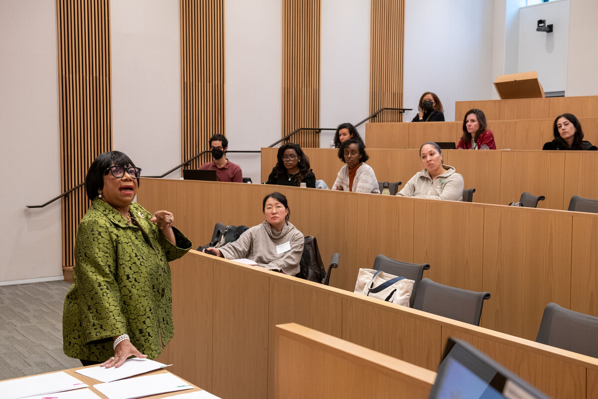 Woman speaking to a classroom of law students