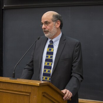 Professor Jim Silk standing at lecturn