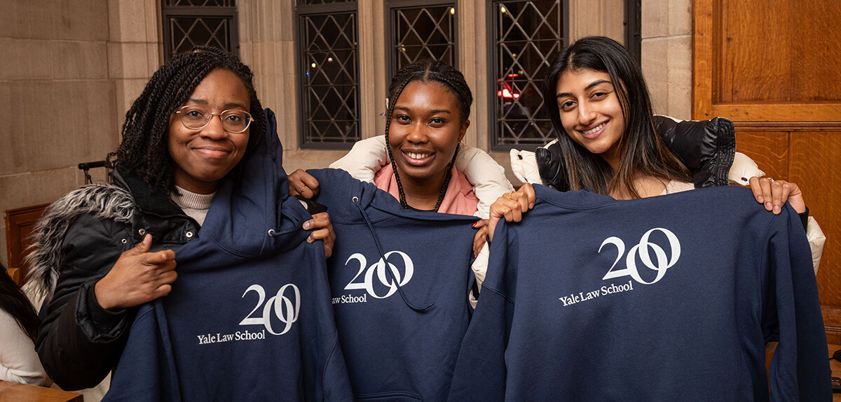 Three students with 200th sweatshirts