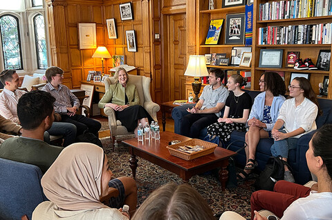 Dean Heather Gerken sits with a group of first year students in her office