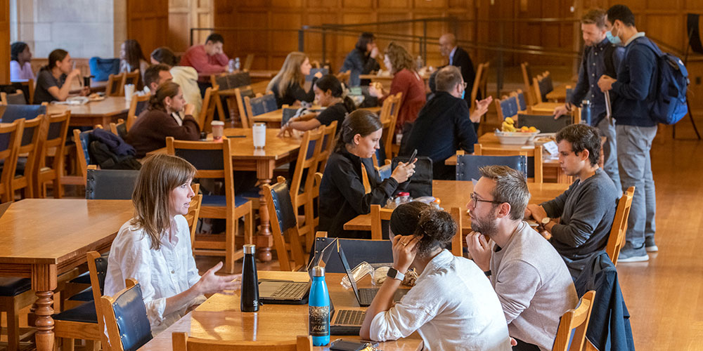 Students meet in the dining hall to study over a meal.