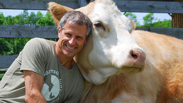 Gene Baur with cow