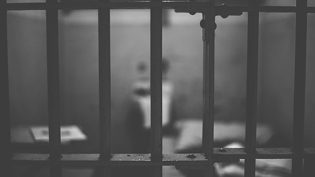 image of bars in a prison cell