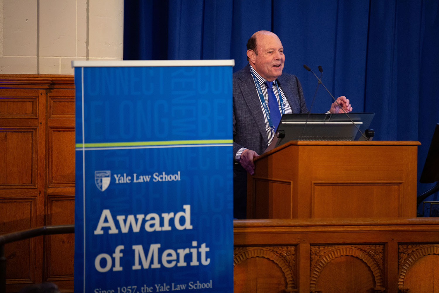 Gene Ludwig speaks after receiving the Award of Merit