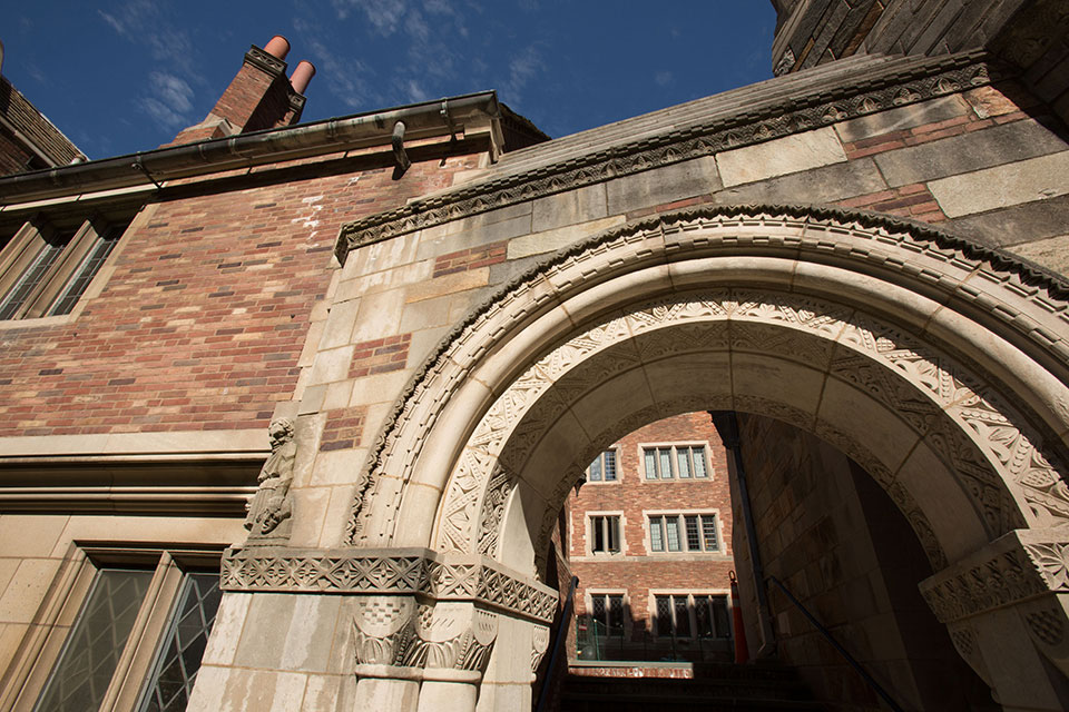 Stone archway in the courtyard of Sterling Law Building