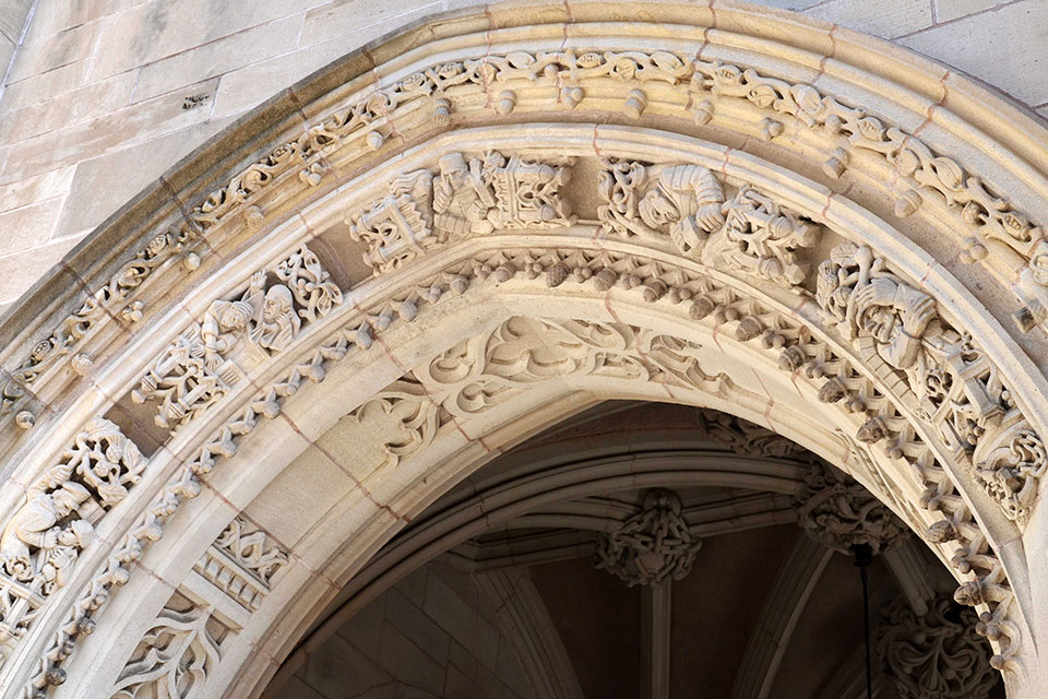 Stone carvings in an archway of Sterling Law Building