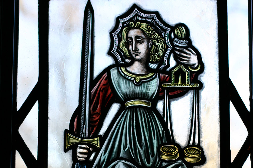stained glass window of Lady Justice