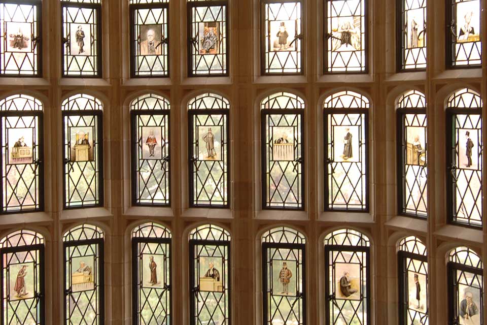Atmospheric photo of the stained glass windows at Yale Law School
