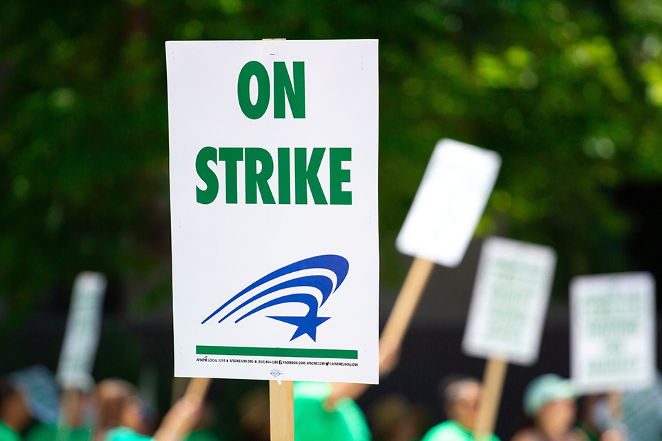 a sign that says "on strike"