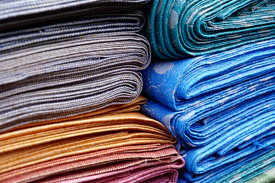 pile of colored textiles