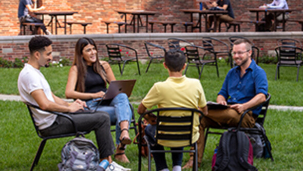 YLS students sitting in the courtyard