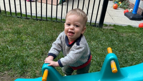 small child playing on grass