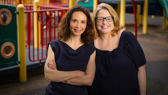 Jessica Sager and Janna Wagner standing in front of a playground