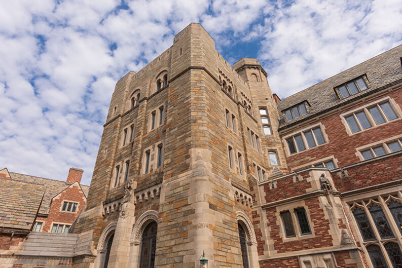 As seen from the courtyard of Sterling Law Building, the main stairwell's exterior stone walls  exterior stone walls protrude from the brick façade 