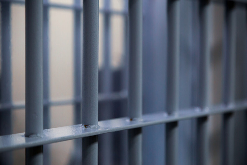 A close-up of bars on a prison cell