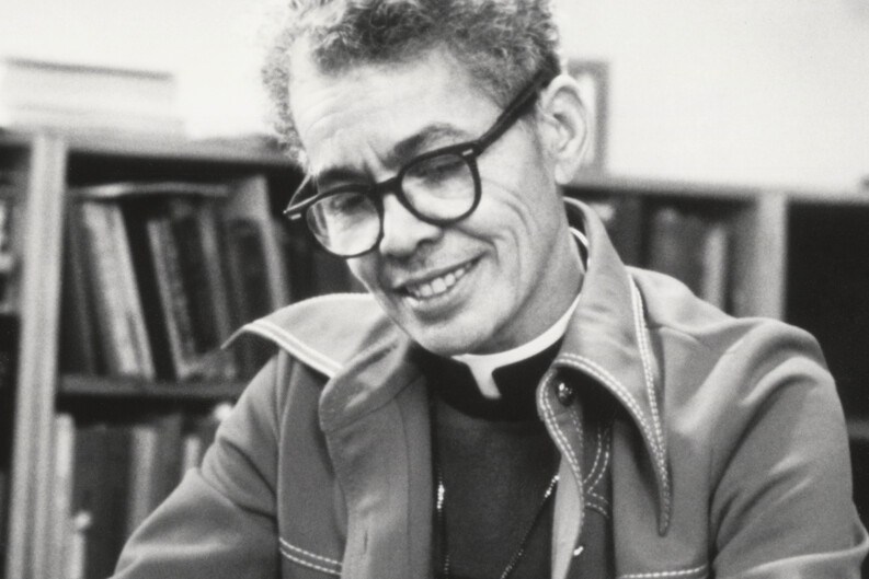 Photo of Reverend Dr. Pauli Murray ’65 JSD writing at a desk.