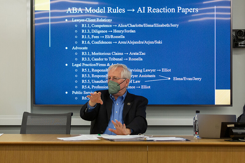 Professor Bill Eskridge in front of a projector screen