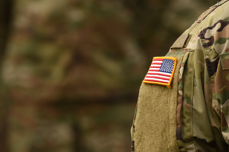 detail of a U.S. flag on an army uniform