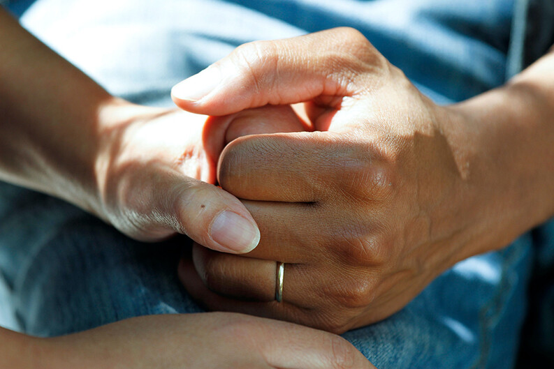 palliative care holding hands