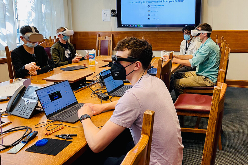 students wearing virtual reality headsets in a classroom