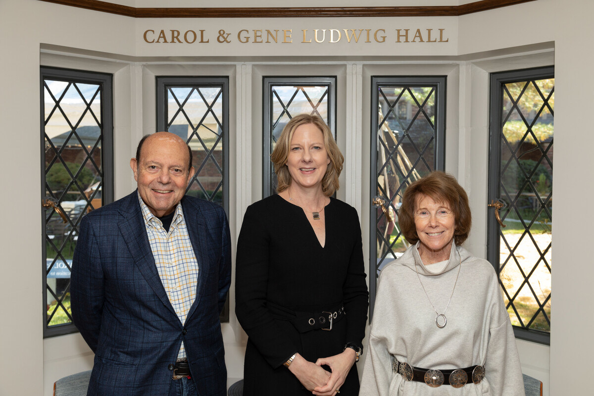 Gene ’73 and Carol Ludwig pose for a photo with Dean Heather Gerken