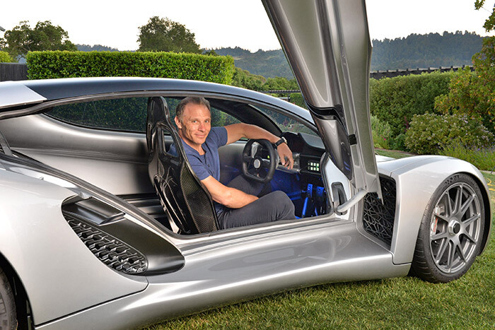 Kevin Czinger sitting in the world's first 3D printed car