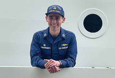 Joe Sullivan-Springhetti in military uniform on a ship