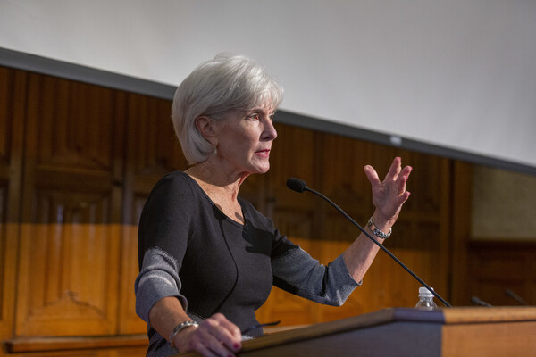 Kathleen Sebelius speaks at a podium and gestures with her left hand.