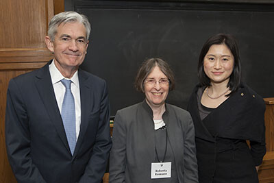 Federal Reserve Chairman Jerome Powell, Professor Roberta Romano, and Nancy Liao  stand side by side