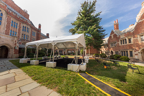 A white tent set up in the law school courtyard.