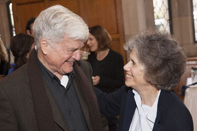 Dennis Curtis and Judith Resnick in profile smiling at each other