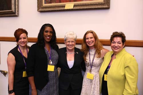 Four campaign school participants posing with Nancy Wyman in the center