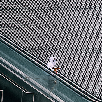 person using electric escalator