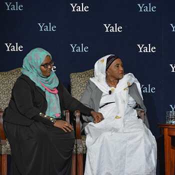 Dr. Hawa Abdi and Dr. Deqo Mohamed seated in front of a backdrop with the Yale logo
