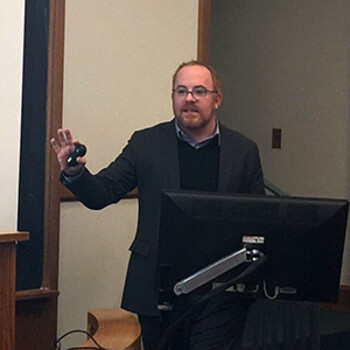 Matthew Kavanaugh speaking in front of a classroom