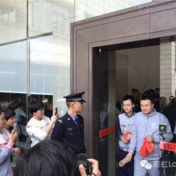 Sun Wenlin and Hu Mingliang exit the court where they sued for a marriage license in 2016.