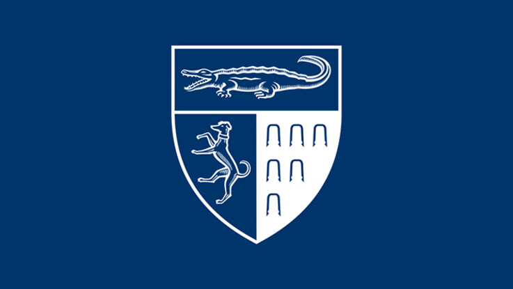 The Yale Law School shield in white on a blue background