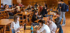 Students meet in the dining hall to study over a meal.