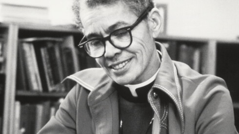 Photo of Reverend Dr. Pauli Murray ’65 JSD writing at a desk.