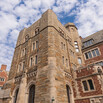 As seen from the courtyard of Sterling Law Building, the main stairwell's exterior stone walls  exterior stone walls protrude from the brick façade 