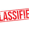 The word "CLASSIFIED" in red letters in the style of a rubber stamp