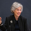 Professor Judith Resnik standing before a chalkboard