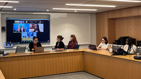 Panelists and audience members at an event on disability law