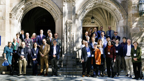 participants from a conference standing on the front steps of Yale Law School