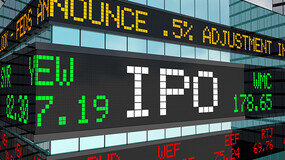 A stock ticker showing various prices with the letters IPO prominently displayed in the center