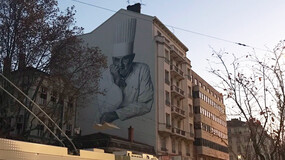 A mural of chef Paul Bocuse on a building in Lyon, France