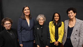 Standing in front of a chalkboard, from left: Sheryl Gordon McCloud, Associate Justice, Washington Supreme Court; Anita Earls, Associate Justice, North Carolina Supreme Court; Judith Resnik, Arthur Liman Professor of Law, Yale Law School; Vanita Gupta, Associate Attorney General of the United States; and Lisa Foster, former Director, U.S. Department of Justice, Access to Justice Office