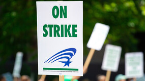 a sign that says "on strike"