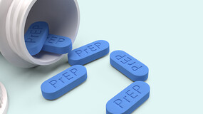 blue PrEP pills and a prescription bottle
