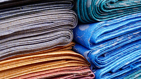 pile of colored textiles